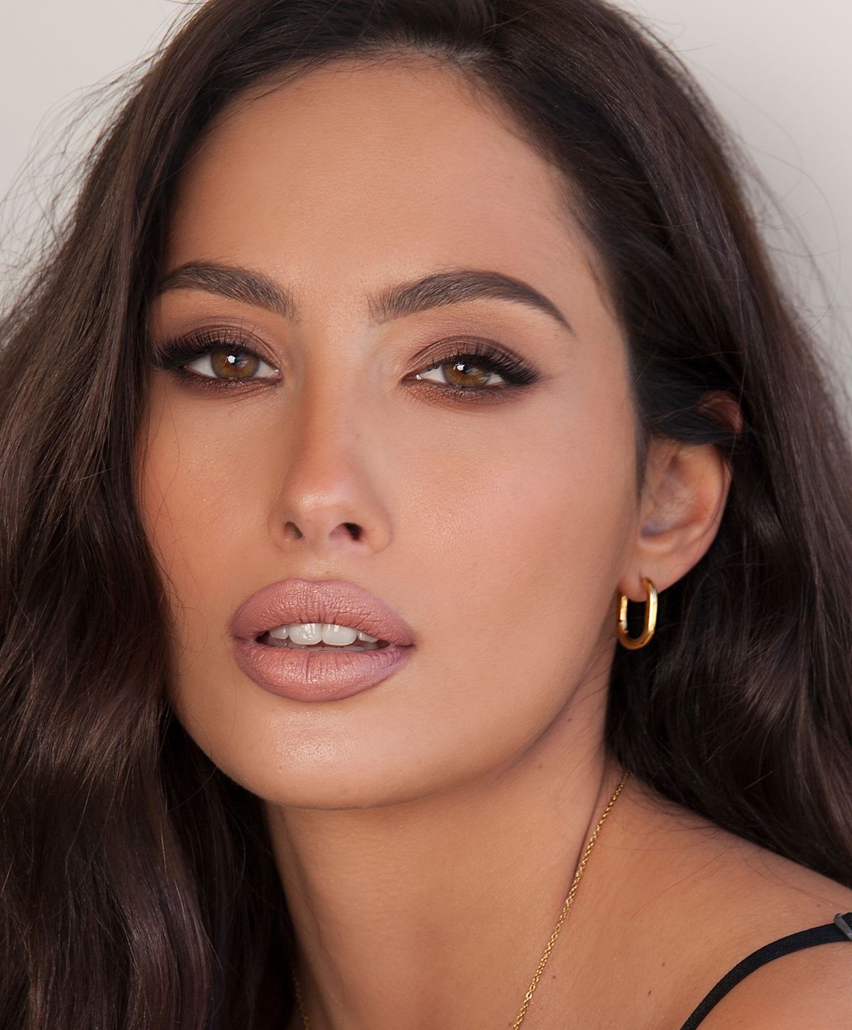 Portrait of a woman with curly hair.