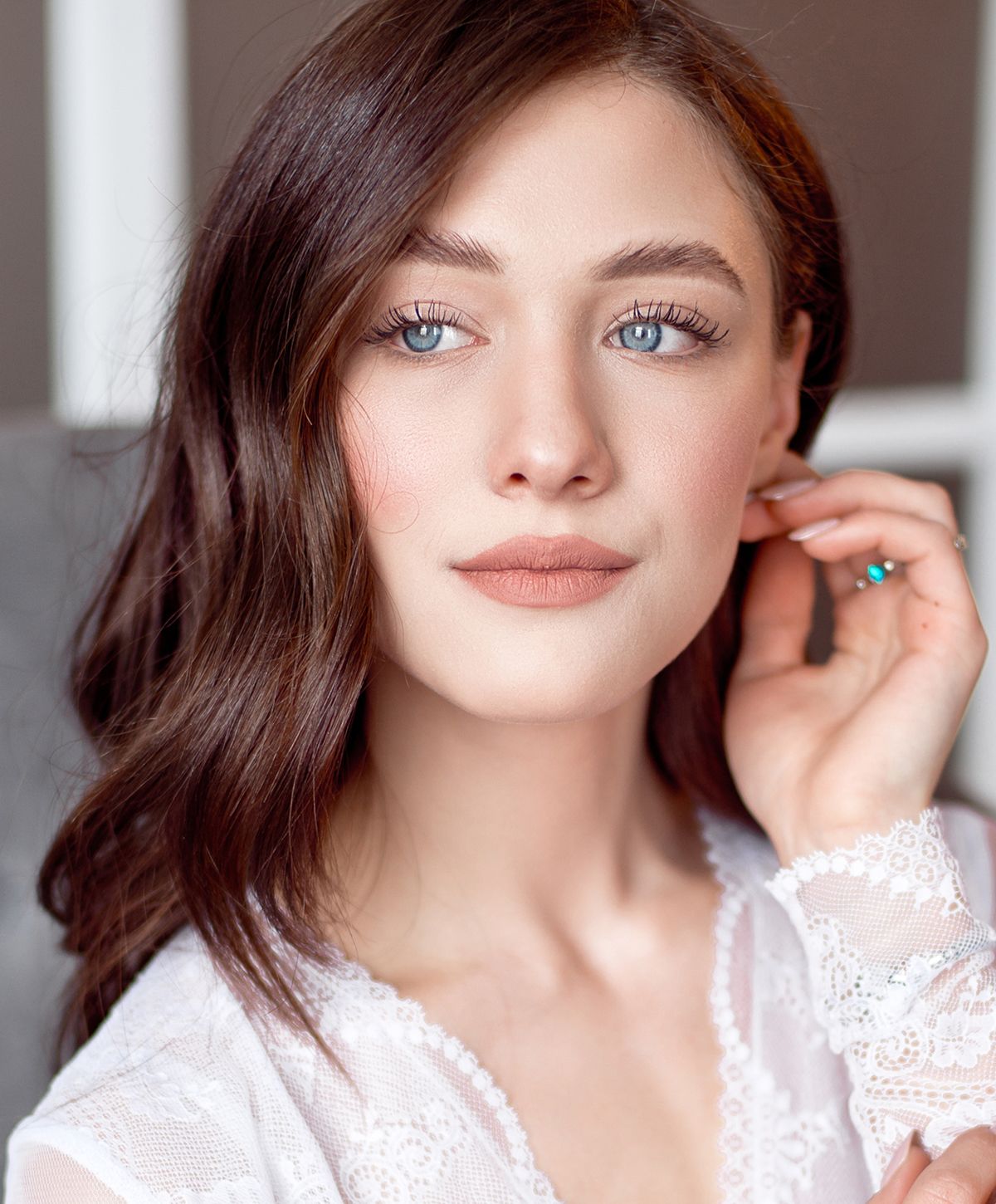 Portrait of a young woman with wavy hair.