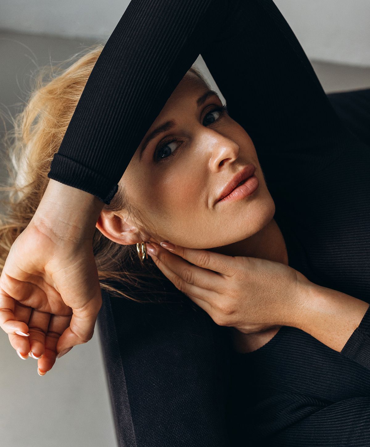 Woman with short hair in soft sunlight.