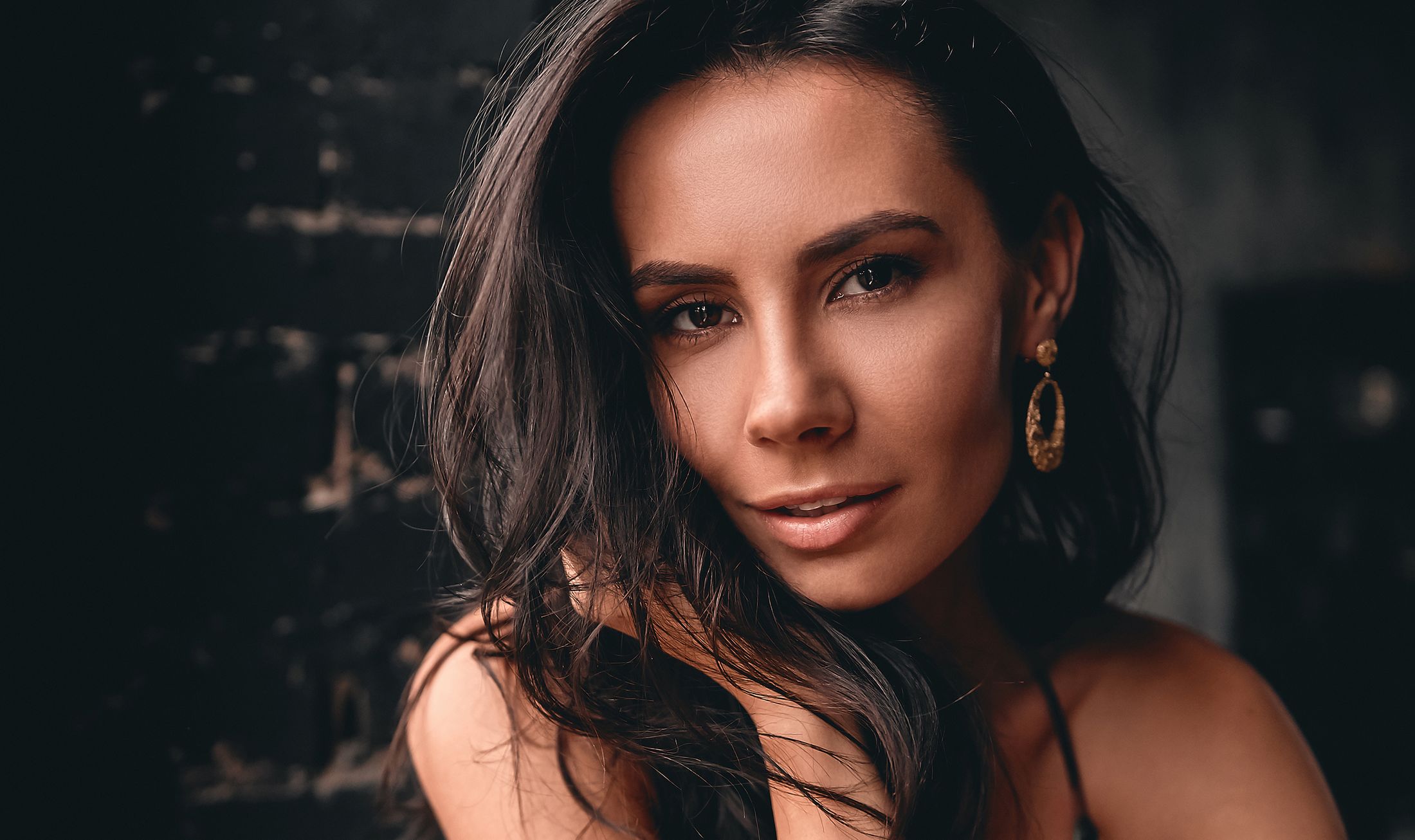 Portrait of a woman with long dark hair.